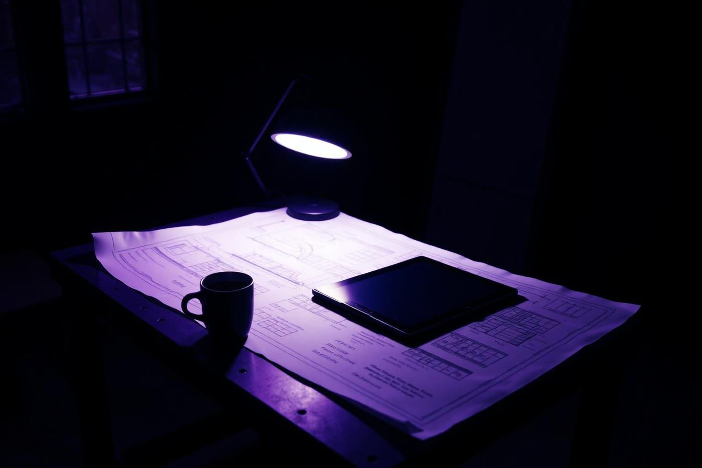 Website wireframes and plans laid out on a desk